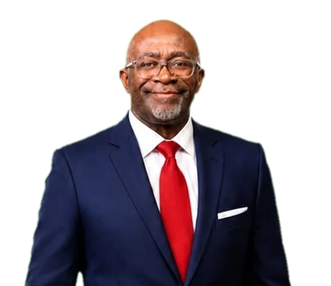 Dr. David Rex Orgen in a navy suit